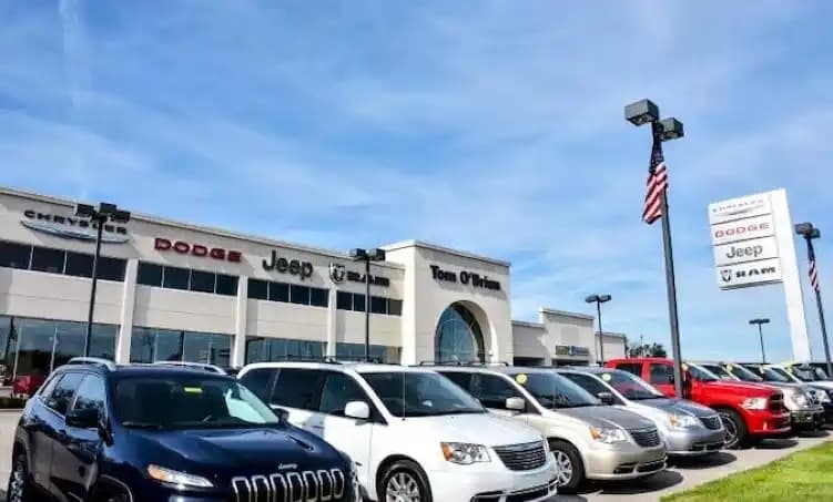 Dealership lot with vehicles ready for transport